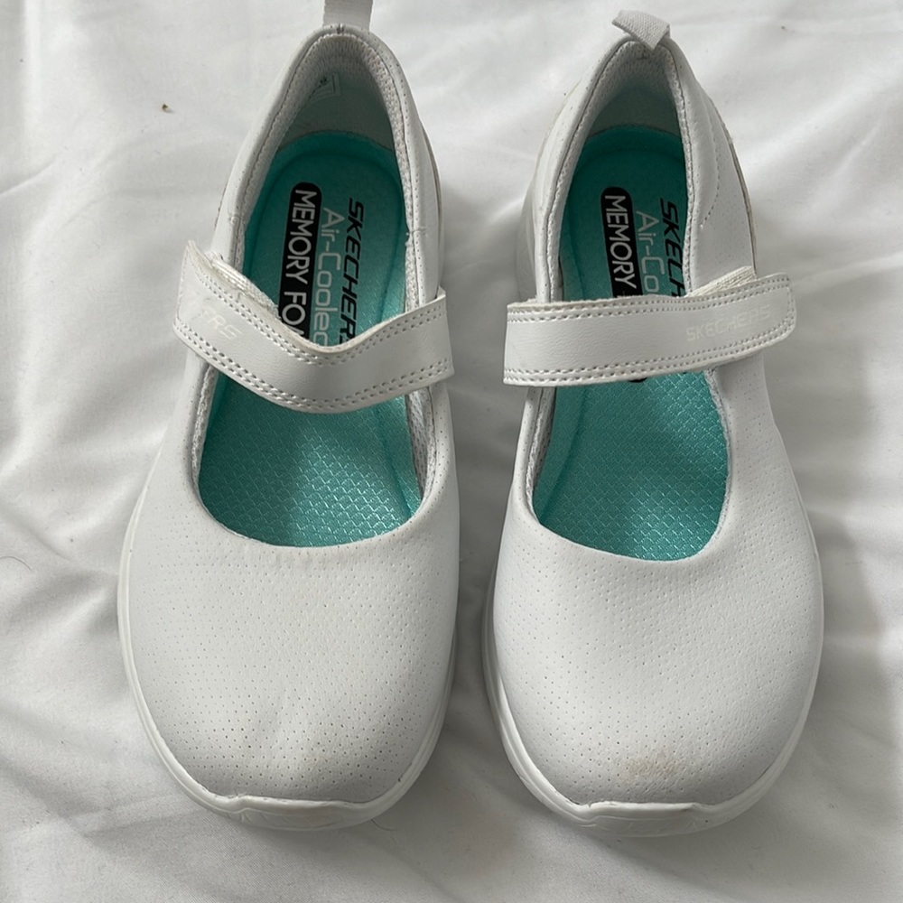 Girls white sketchers shoes